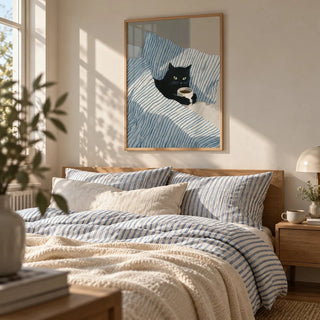 Cat in Bed Print, framed on the wall of a cosy bedroom