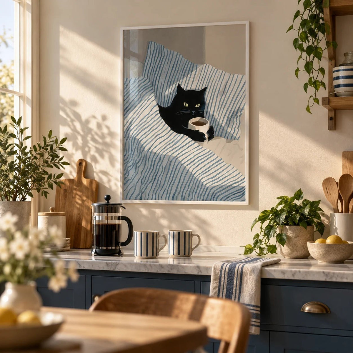 Cat in Bed Print, framed on the wall of a cosy kitchen corner