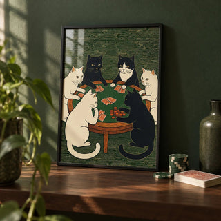 Cat Poker Art Print, a small A4 framed print leaning on a dark wood shelf in a living room