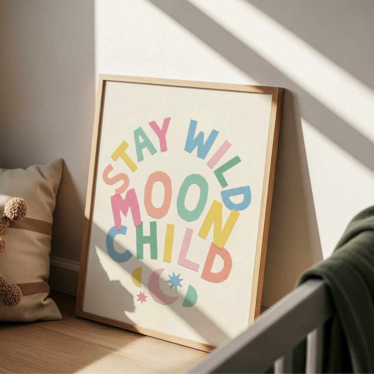 Colorful typographic print showing “MOON CHILD” letters with small star shapes