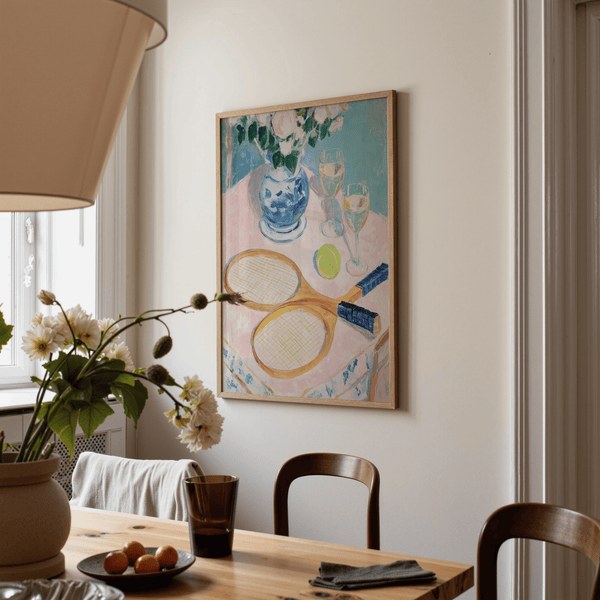 Soft painterly poster print showing tennis rackets, tennis ball, and tabletop objects
