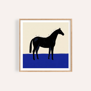Black Horse Wall Art print framed against beige wall