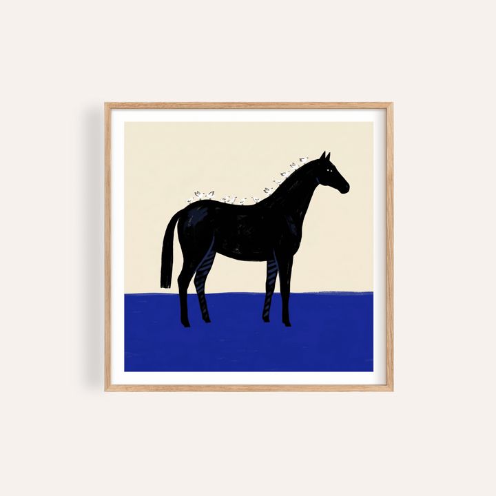 Black Horse Wall Art print framed against beige wall