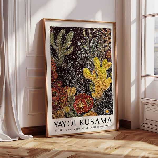 Coral reef art print with yellow and red marine forms on a dark background.