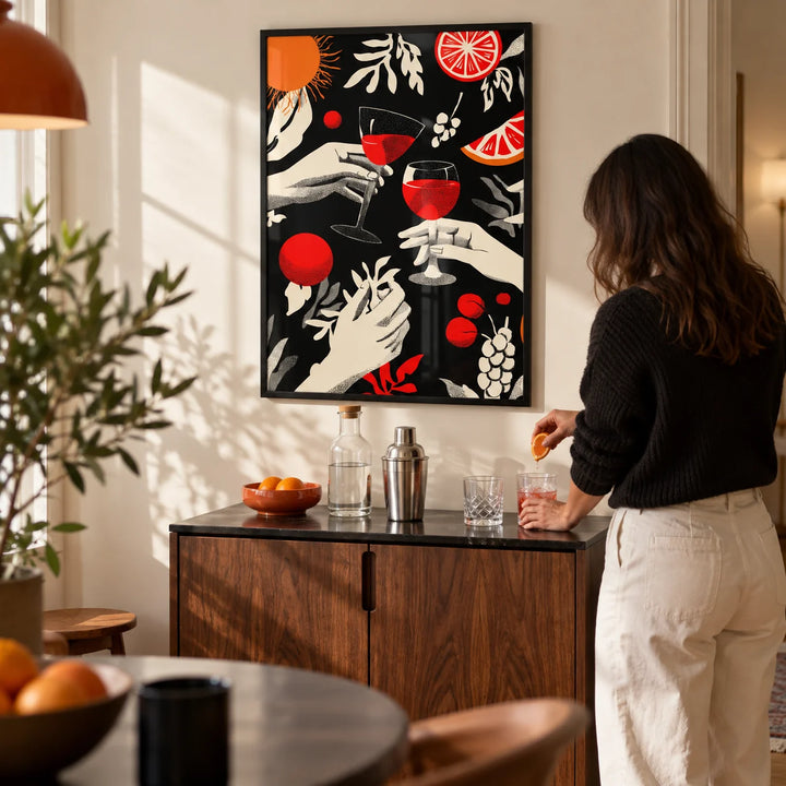 Celebration Wall Art, framed on the wall of a compact home bar corner in a design-led UK flat with a cream wall in a living room
