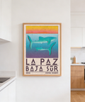 Coastal wildlife illustration with oversized LA PAZ letters and horizon stripe