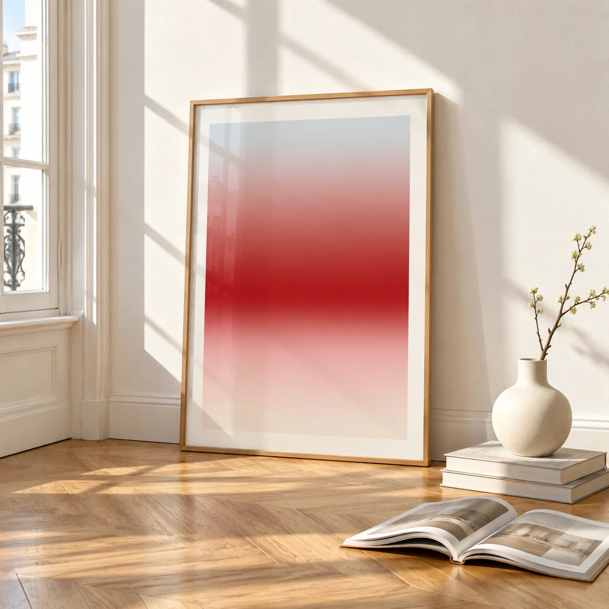 Cherry Glow Print, framed and leaning on the parquet floor of a bright living room
