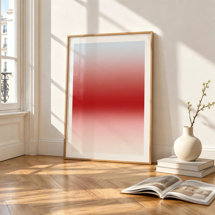 Cherry Glow Print, framed and leaning on the parquet floor of a bright living room