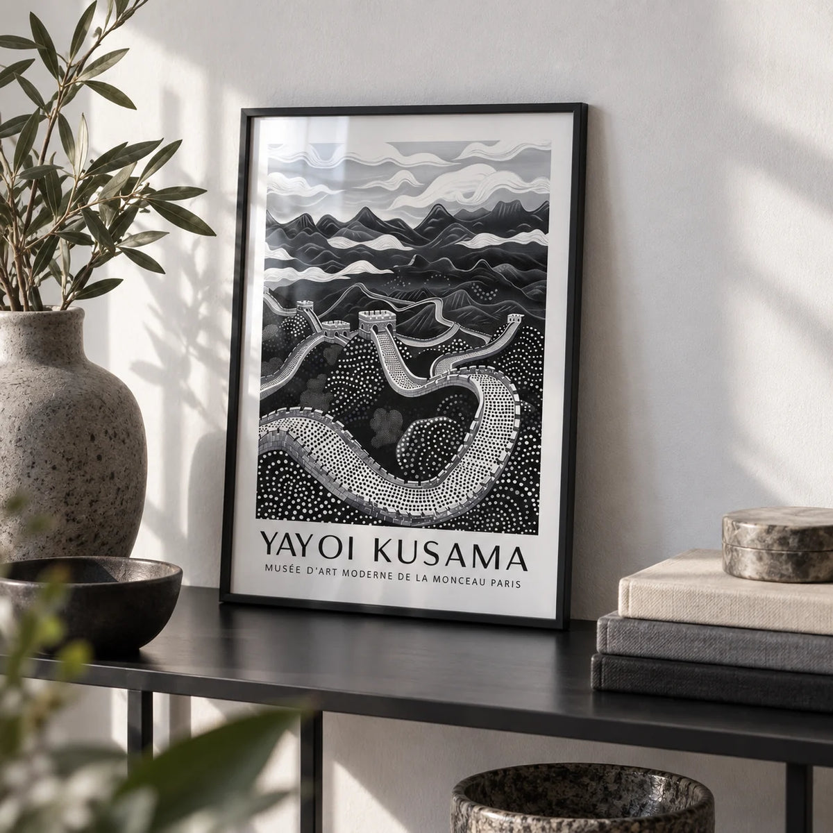 Chinese Wall Art, a small A4 framed print leaning on a black metal shelf in a living room
