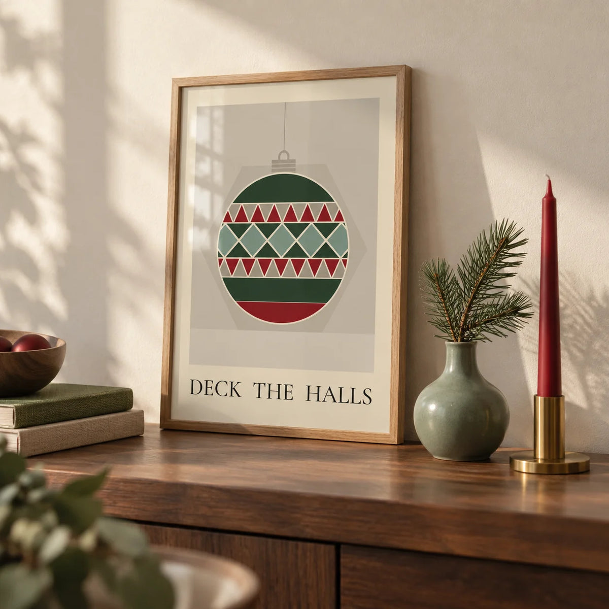 Christmas Bauble Print, a small A4 framed print leaning on a walnut shelf in a living room