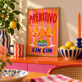 Cin Cin Print, a small A4 framed print leaning on a colourful lacquered shelf in a living room