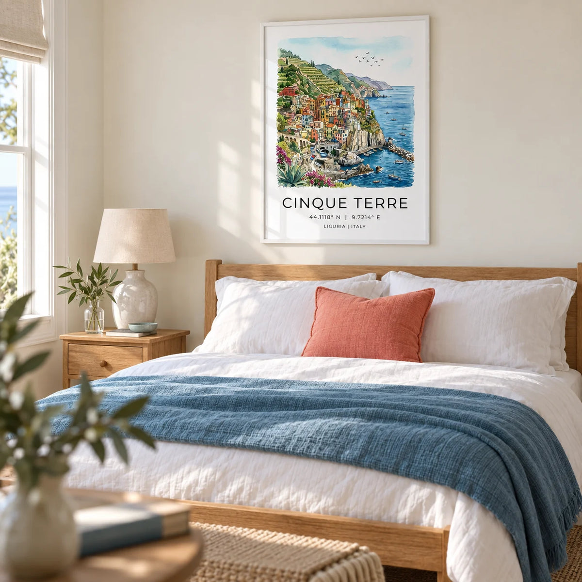 Cinque Terre Art Print, framed on the wall of a calm coastal bedroom in a UK home with pale cream walls
