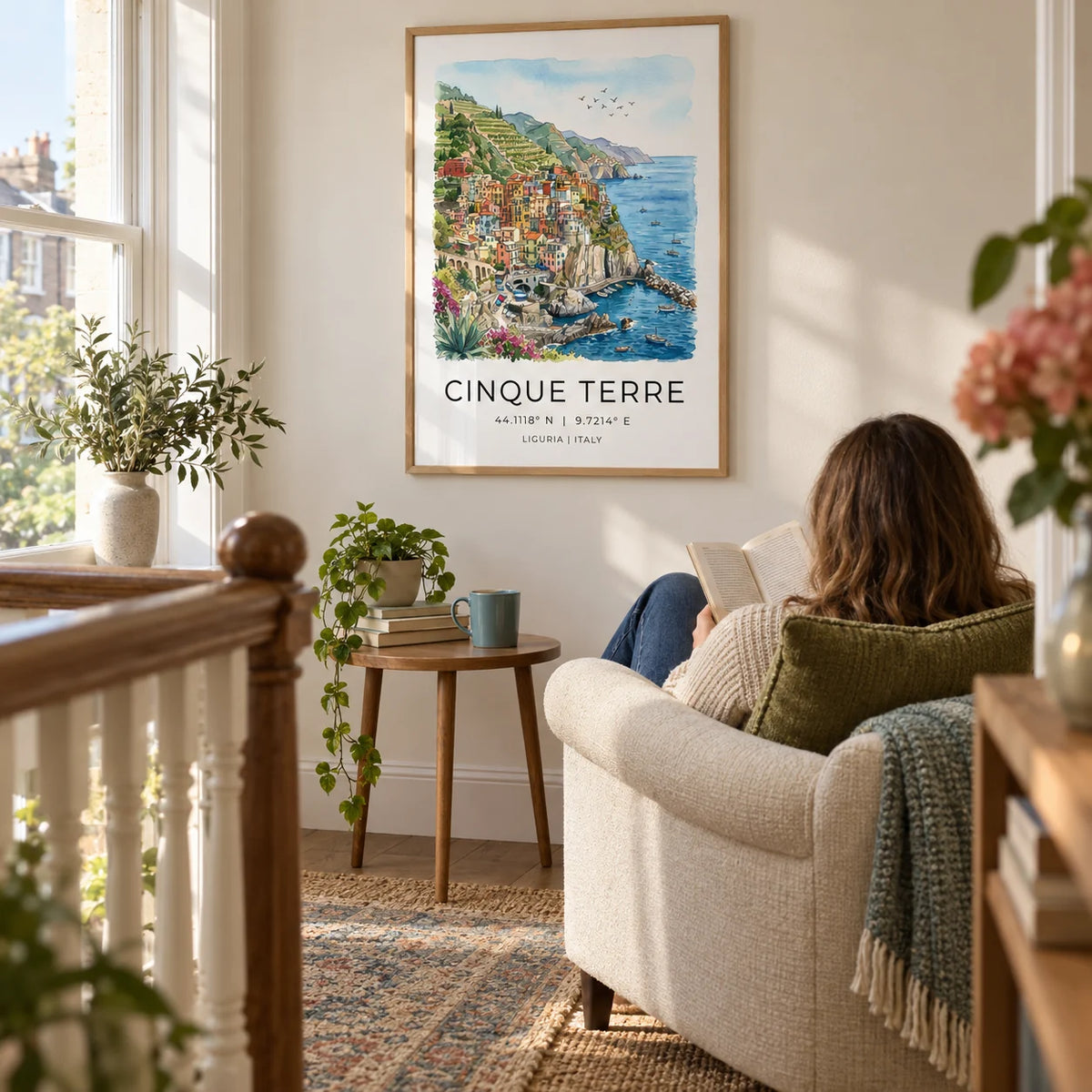 Cinque Terre Art Print, framed on the wall of a quiet reading corner on a spacious landing in a UK terraced house with a warm white wall in a living room
