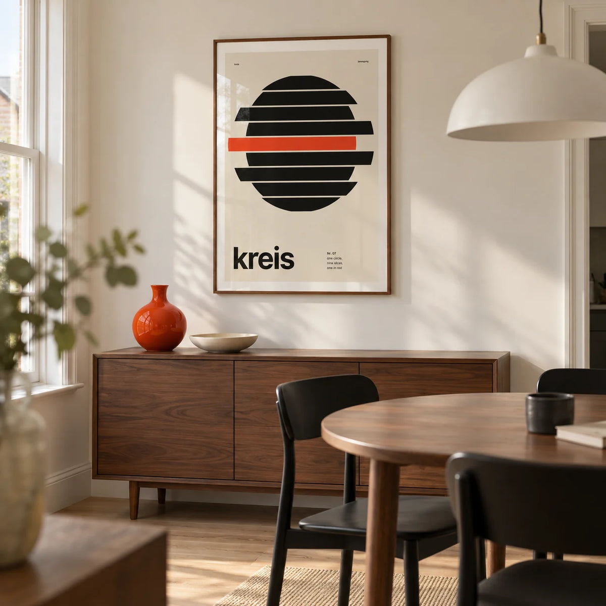 Circle Print, framed on the wall of a crisp modern dining room in a UK terraced house with an off-white wall and pale oak floor