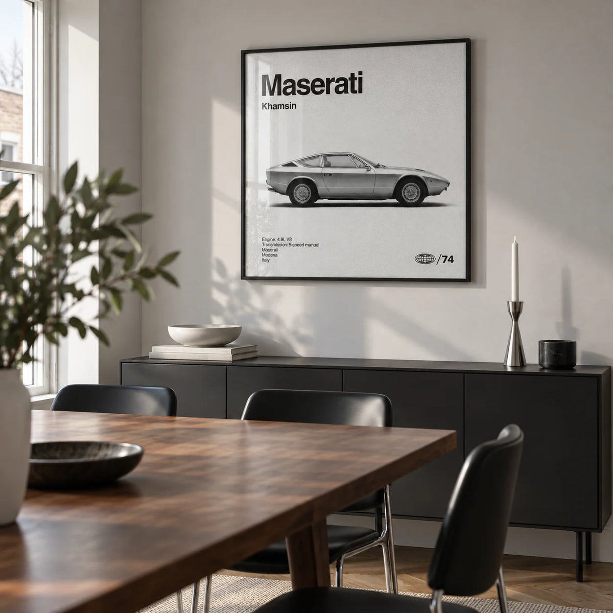 Classic 1970s Grand Tourer Poster, framed on the wall of a compact dining room in a design-conscious UK flat with pale grey walls and a walnut dining table
