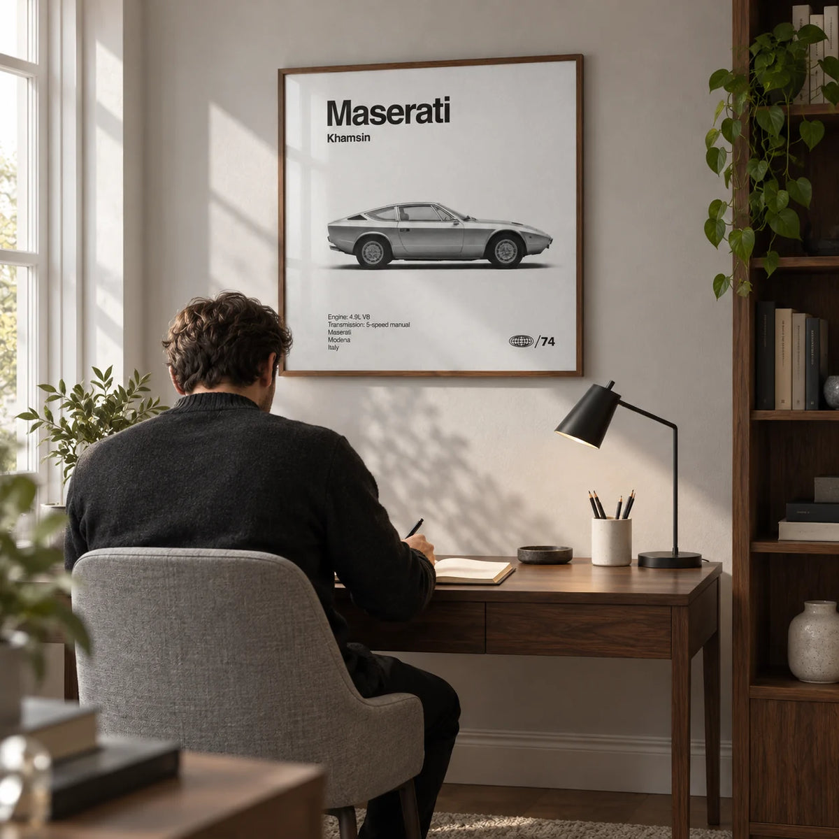 Classic 1970s Grand Tourer Poster, framed on the wall of a quiet home study in a renovated UK terrace with a pale grey wall and walnut shelving