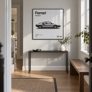 Classic 1980s Italian Coupe Poster, framed on the wall of a bright entrance hallway in a contemporary UK maisonette with a pale grey wall and oak floor