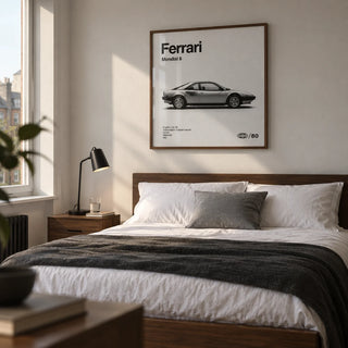 Classic 1980s Italian Coupe Poster, framed on the wall of a restrained bedroom for a car enthusiast in their thirties in a UK flat with an off-white wall