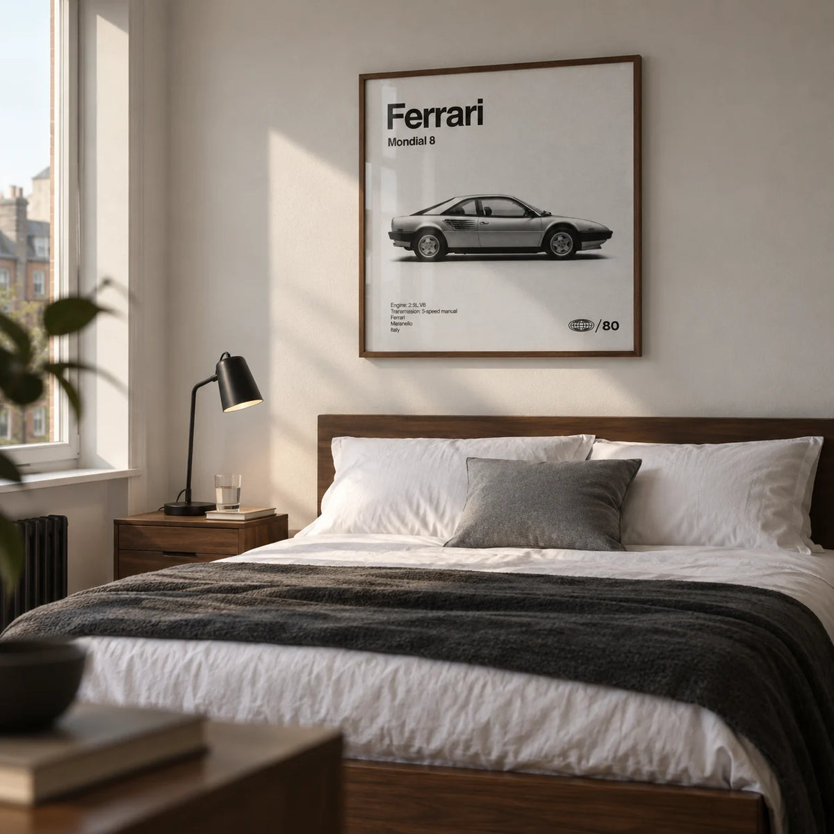 Classic 1980s Italian Coupe Poster, framed on the wall of a restrained bedroom for a car enthusiast in their thirties in a UK flat with an off-white wall