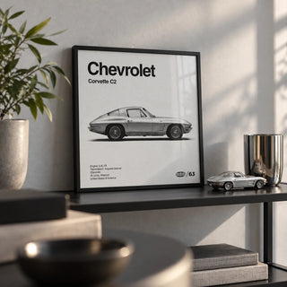 Classic American Sports Car Poster, a small A4 framed print leaning on a black metal shelf in a living room