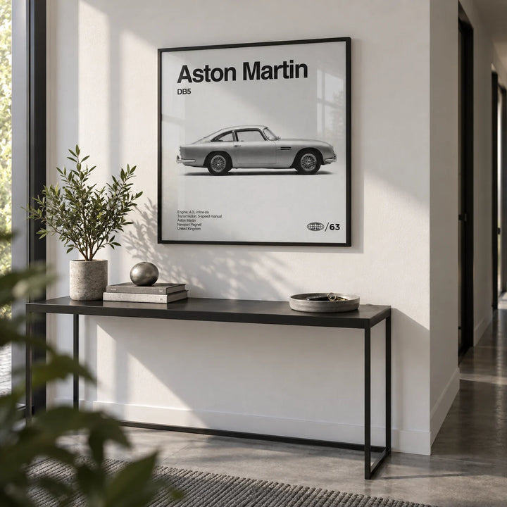 Classic British Grand Tourer Poster, framed on the wall of a crisp modern hallway with a white wall and a grey floor