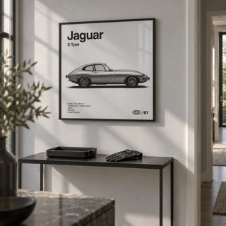 Classic British Sports Car Poster, framed on the wall of a crisp hallway with a pale grey wall