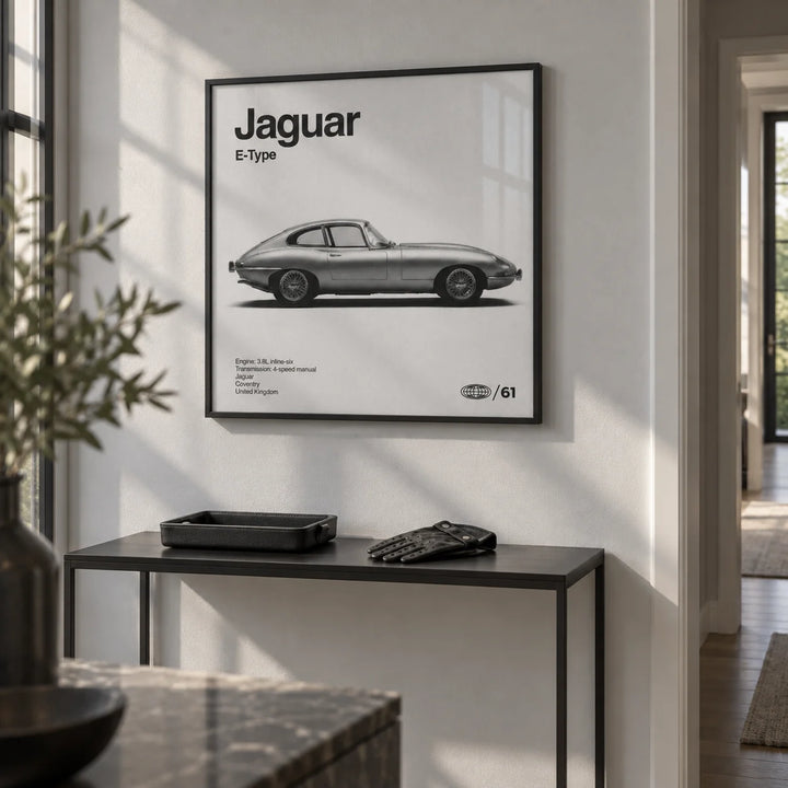 Classic British Sports Car Poster, framed on the wall of a crisp hallway with a pale grey wall