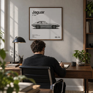 Classic British Sports Car Poster, framed on the wall of a modern home office with a soft grey wall