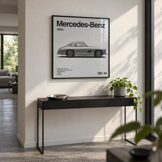Classic Gullwing Sports Car Poster, framed on the wall of a modern hallway with a white wall and a grey floor