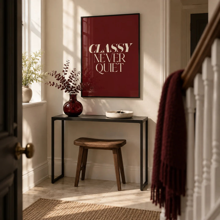 Classy Wall Art, framed on the wall of a stylish narrow entrance hallway in a UK townhouse with warm white walls and pale stone flooring