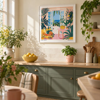 Coastal Wall Art, framed on the wall of a bright kitchen in a renovated UK terrace with muted dark green cabinets