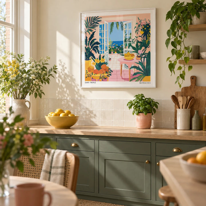 Coastal Wall Art, framed on the wall of a bright kitchen in a renovated UK terrace with muted dark green cabinets