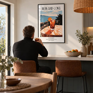 Cocktail recipe poster, framed on the wall of an open-plan kitchen-diner with a white wall