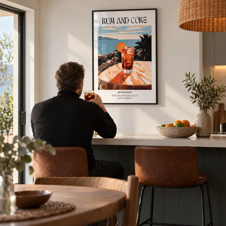 Cocktail recipe poster, framed on the wall of an open-plan kitchen-diner with a white wall