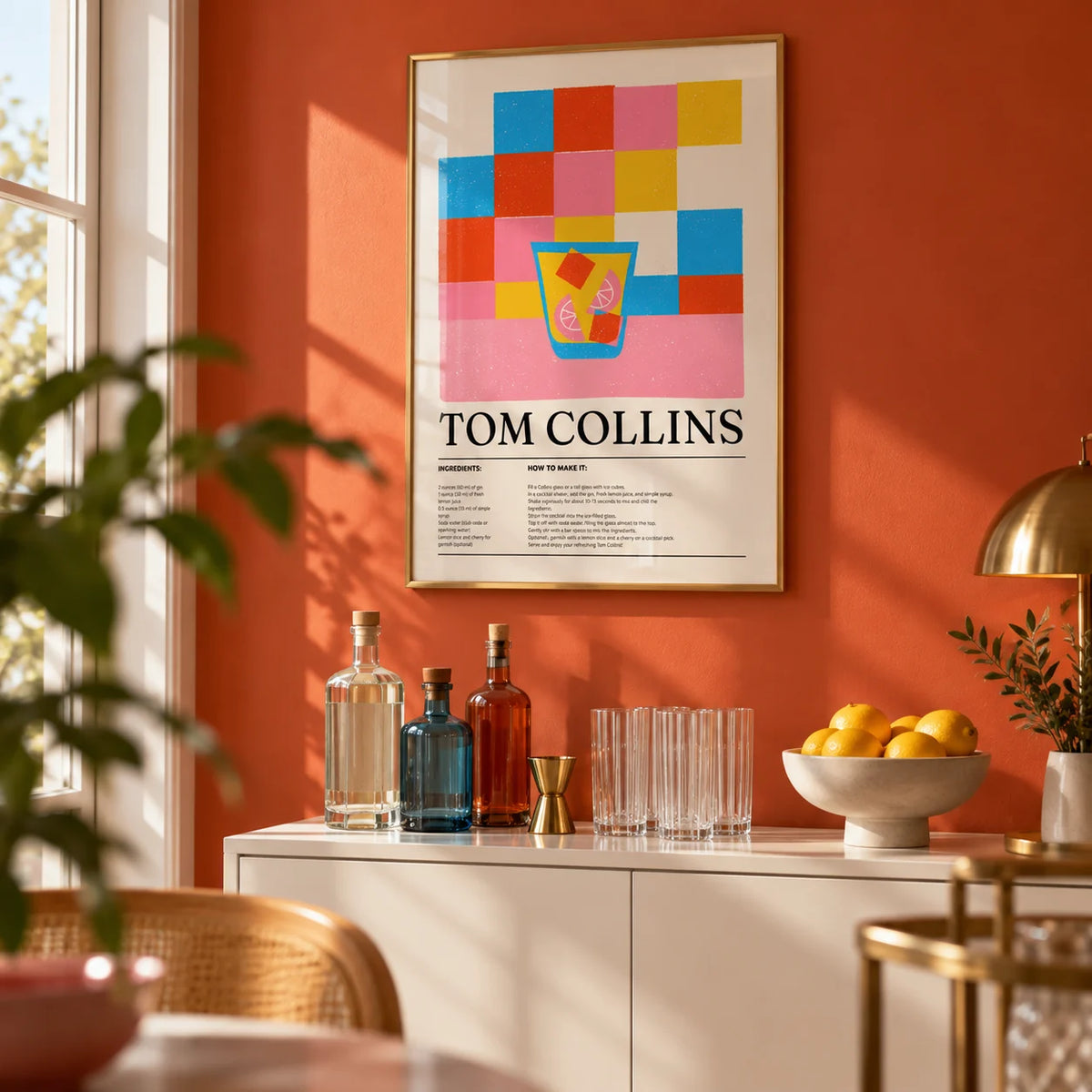 Colorful Bar Prints, framed on the wall of a small home bar with a soft orange-red painted wall in a living room