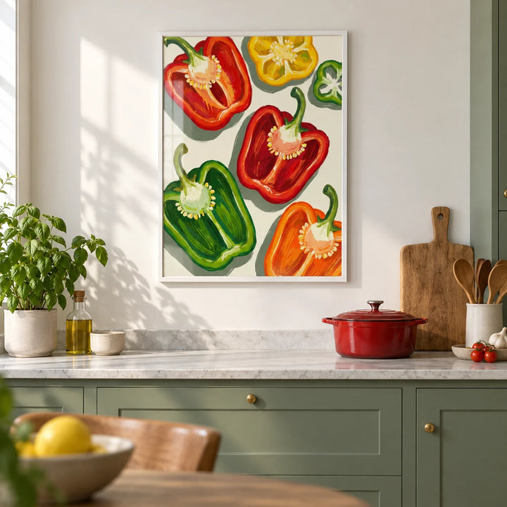 Bell Pepper Art, framed on the wall of a modern kitchen with solid sage green cabinets and a plain white wall