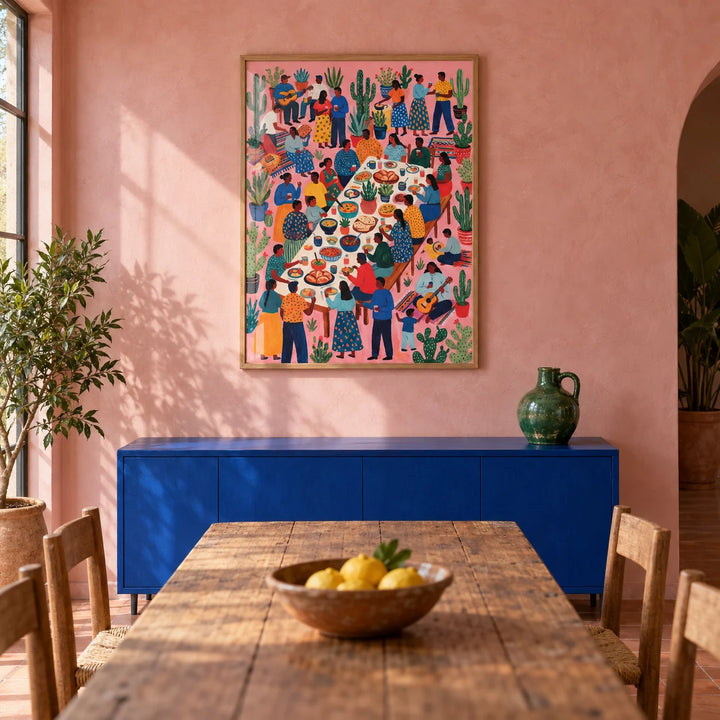 Fiesta Art, framed on the wall of a Mexican-modern dining room with a dusty pink limewashed wall and a plain terracotta floor