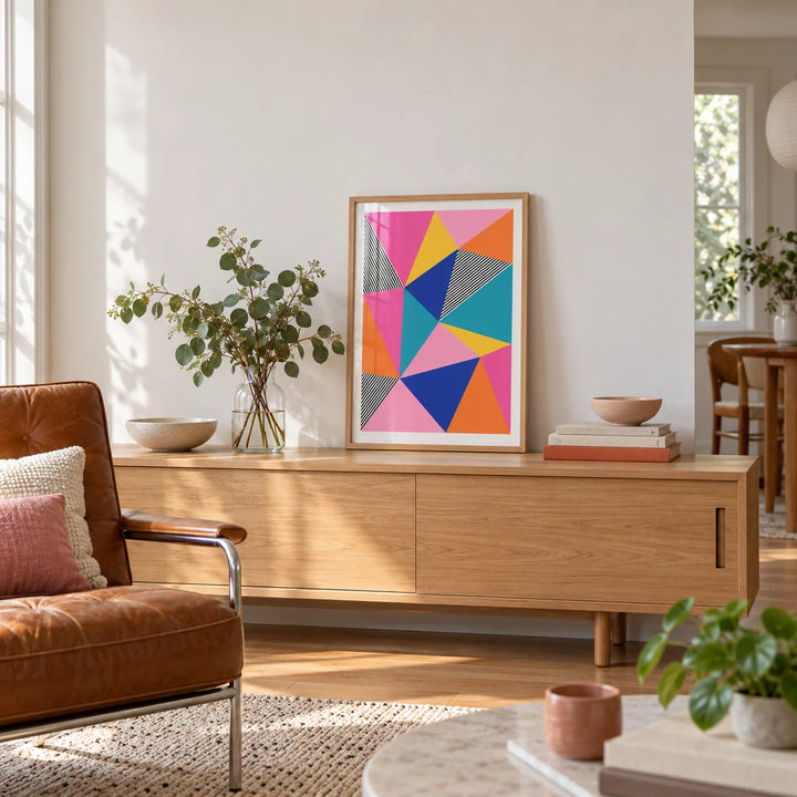 Colorful Geometric Wall Art, a small A4 framed print leaning on a low pale wooden side table in a hallway