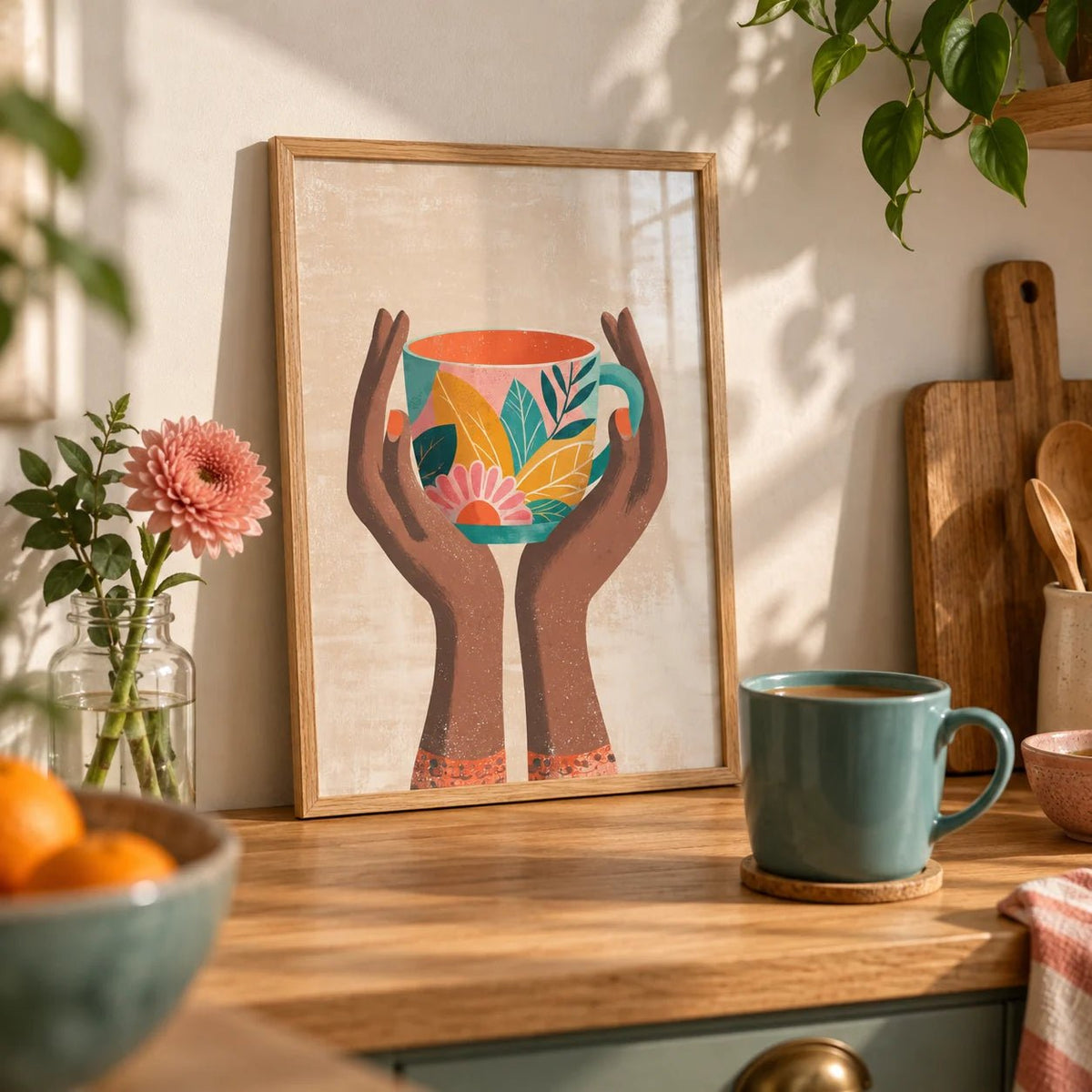 Colorful Mug Art Print, a small A4 framed print leaning on an oak worktop in a kitchen