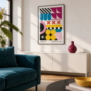 Colorful Prints, framed on the wall of a design-led city-flat living room with a white wall