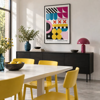 Colorful Prints, framed on the wall of a modern dining room with a white wall and a pale grey floor