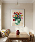 Dining room with a vase of flowers on the table and a colorful floral painting on the wall.