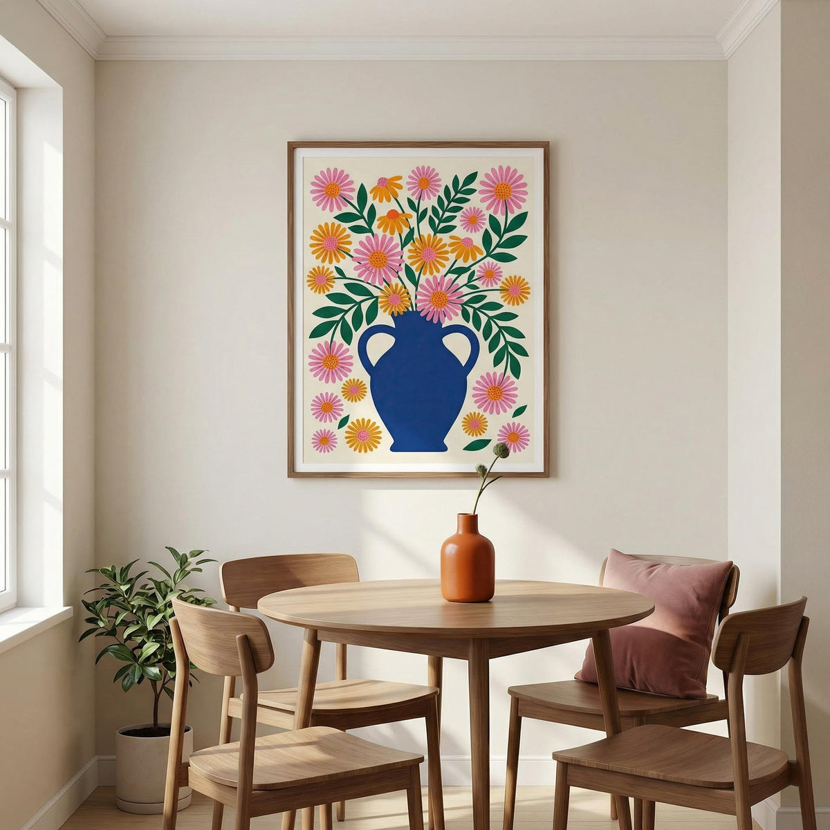 Dining room with a round table, chairs, and a colorful floral painting on the wall.