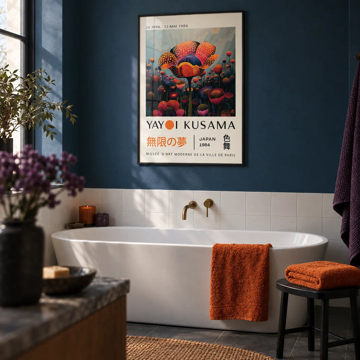 Colourful Flower Prints, framed on the wall of a moody bathroom with a deep blue painted wall and plain white tiles
