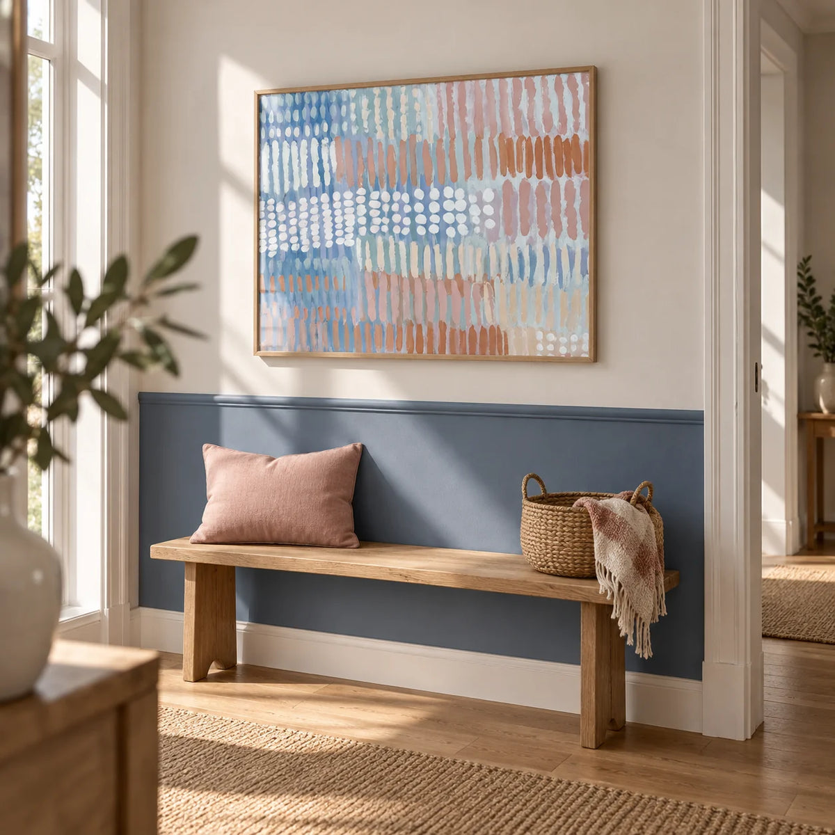 Contemporary Abstract Print, framed on the wall of a bright hallway with a denim blue painted lower wall