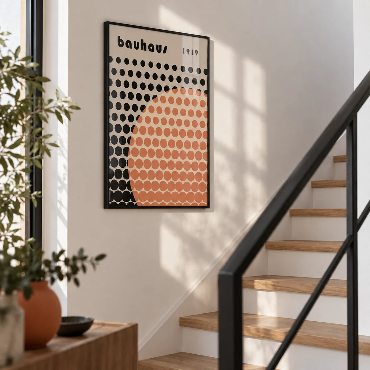 Cool Art Poster, framed on the wall of a modern white stairwell with oak treads
