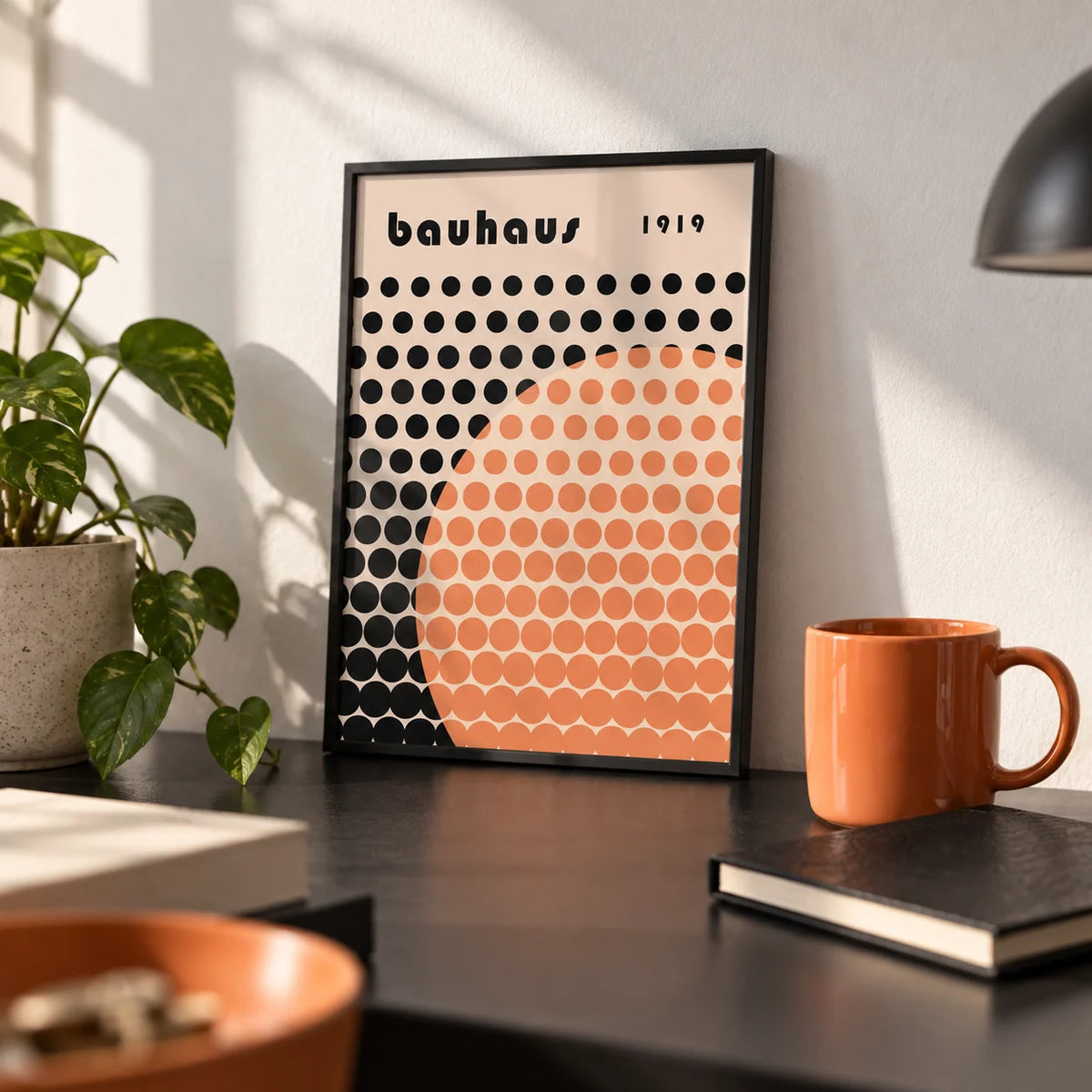 Cool Art Poster, a small A4 framed print leaning on a black desk