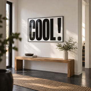 Cool Typography Poster, framed on the wall of a modern hallway with a white wall and a black floor