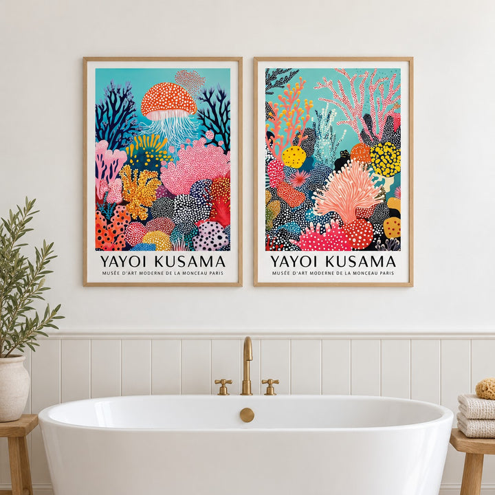 Coral Prints Set of 2 hung at eye level above a freestanding bath: Coral Drift and Ocean Pulse shown framed side by side (frames not included)