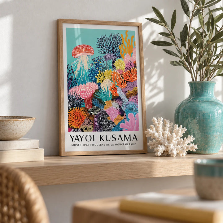 Coral Reef Art, a small A4 framed print leaning on a pale oak shelf in a living room